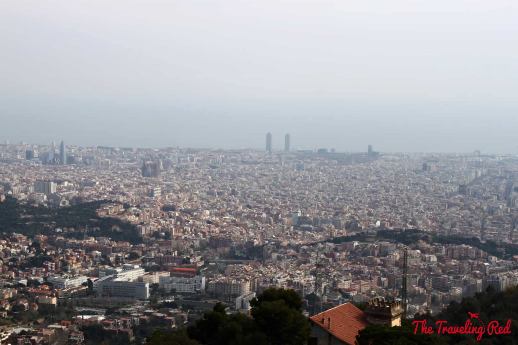 The view of the city from Tibidabo. Tibidabo is a mountain with an amusement park and church on the summit. It is the highest point in the city with incredible sweeping views of Barcelona, Spain.
