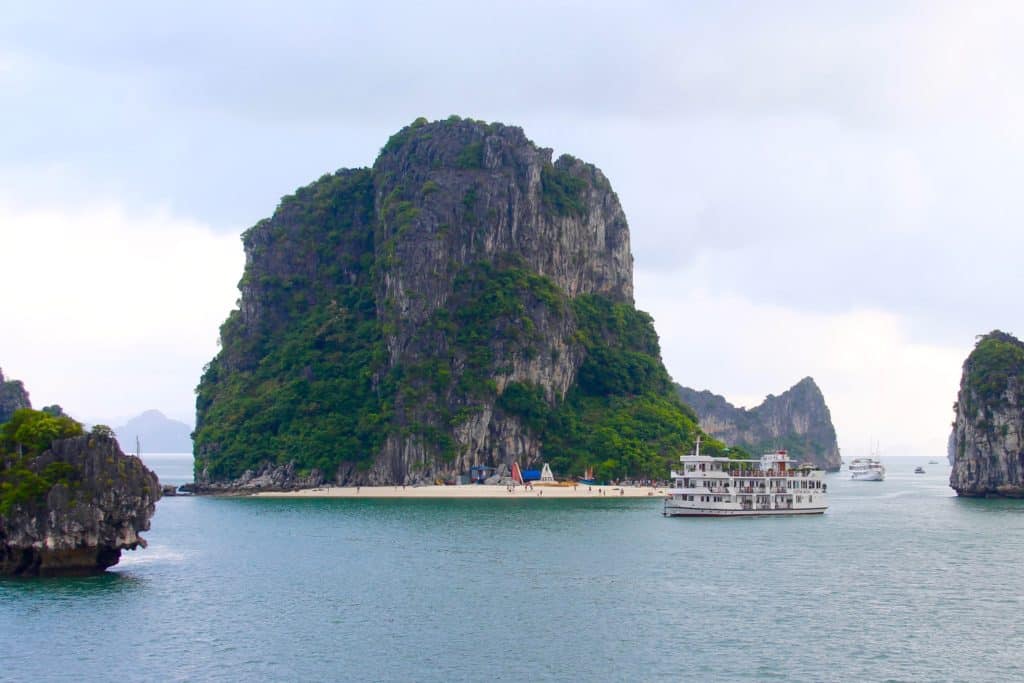A tiny beach in Halong Bay, Vietnam. Romantic cruise in Bai Tu Long Bay, right next to Halong Bay, Vietnam, aboard the Dragon Legend Cruise ship. The best honeymoon destination in Asia. #Halongbay #Vietnam #cruise #honeymoon #honeymoondestination