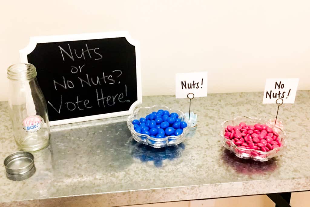 Funny Gender Reveal game - at the entrance everyone got to vote if the baby would have Nuts (using blue Peanut M&M's) or No Nuts (pink plain M&M's)