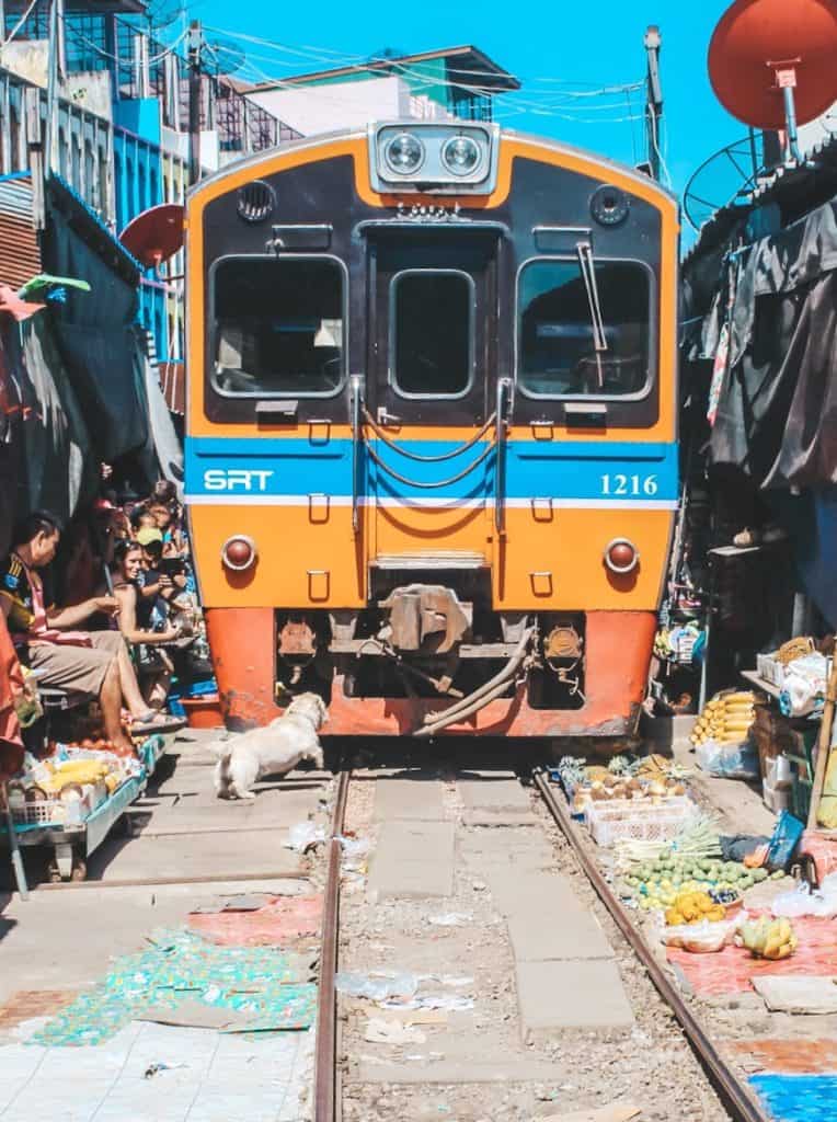 The railway market in Thailand... the train goes right past all the vendors. When the train is coming they pull back their canopies to make space for the train. Tour of the Railway Market and Floating Market from Bangkok, Thailand.  #bangkok #thailand #railwaymarket #floatingmarket 
