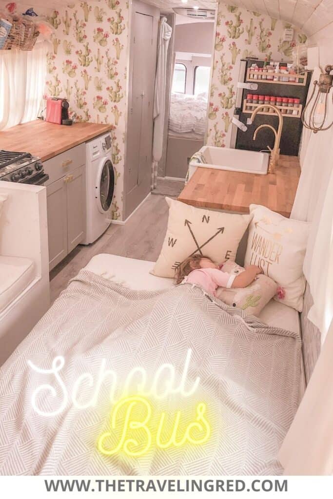 Interior of a yellow school bus turned into a vacation home on wheels. This Skoolie, 2 Cool 4 Skool Bus, has a king size bed, full kitchen, bathtub and even a washer and dryer. Instead of an RV or trailer, you can design your own interior of a school bus. My favorite remodeling and interior design project I've ever done. 