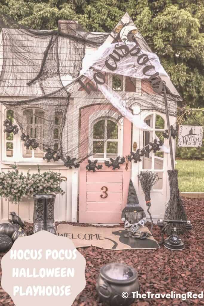 Hocus Pocus Halloween Playhouse - Halloween Decorations to turn a renovated outdoor playhouse into a spooky witches home perfect for playtime during the month of October | added spider webs, bats, witches boots and broomstick, a cauldron and the cutest witch costumes | remodeled DIY pink and white playhouse #playhouse #halloween #witch
