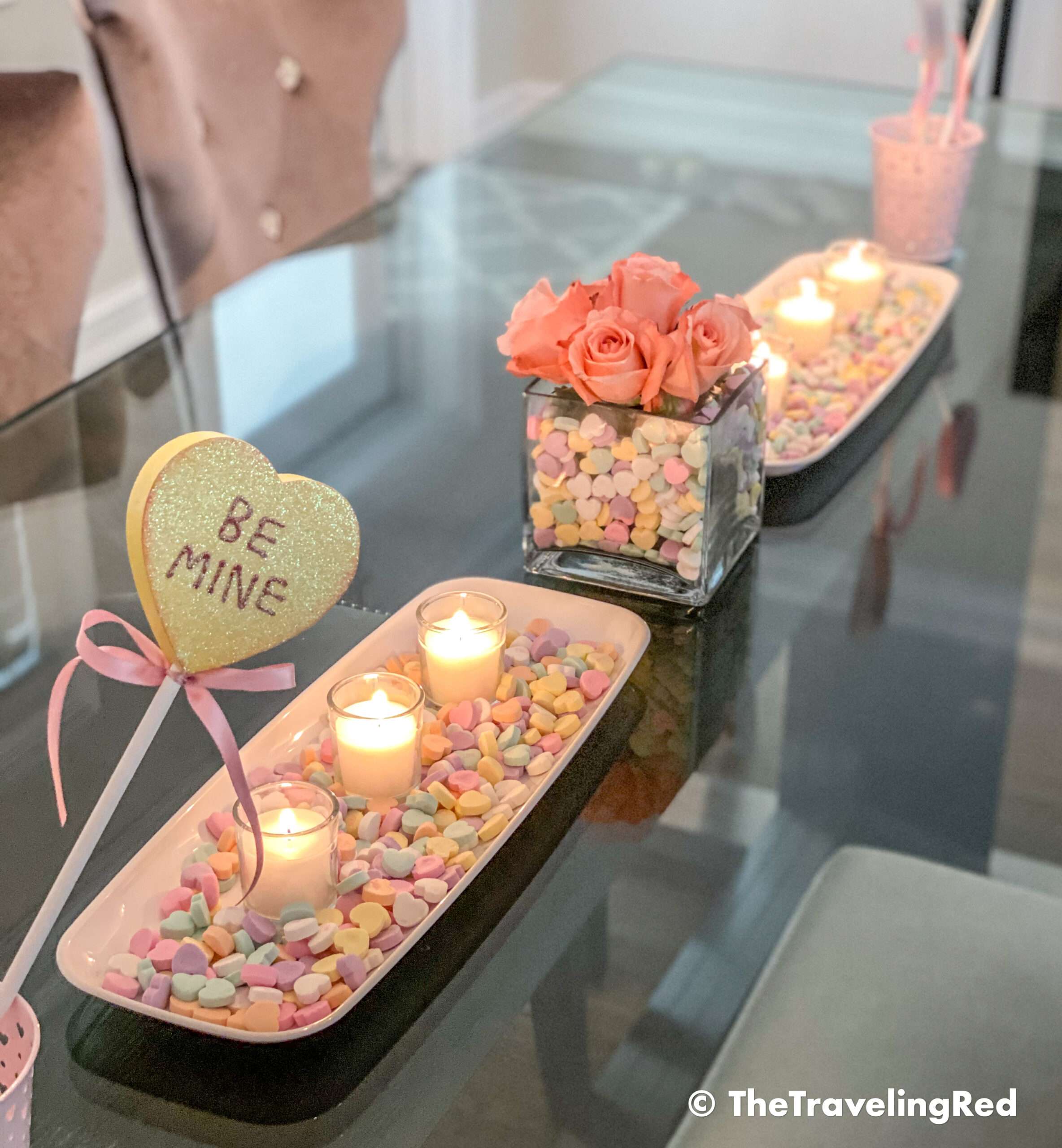 Valentine's Day Home Decor Dining Room Table Decor for a Valentines Day party using plastic trays, glass vases, sweetheart candies, votive candles & fresh roses - #valentinesday #valentinesdaydecor #homedecor #tabledecor #valentinesdayhomedecor