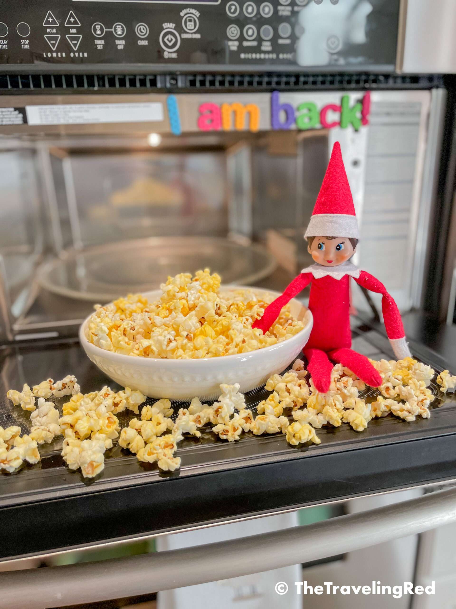 Naughty Elf on the shelf made popcorn and made a huge mess in our kitchen. We had popcorn on the floor and all over the microwave. She also used our magnet letters to leave a message. Fun and easy elf on the shelf ideas for a naughty elf that are quick and easy using things you have at home.