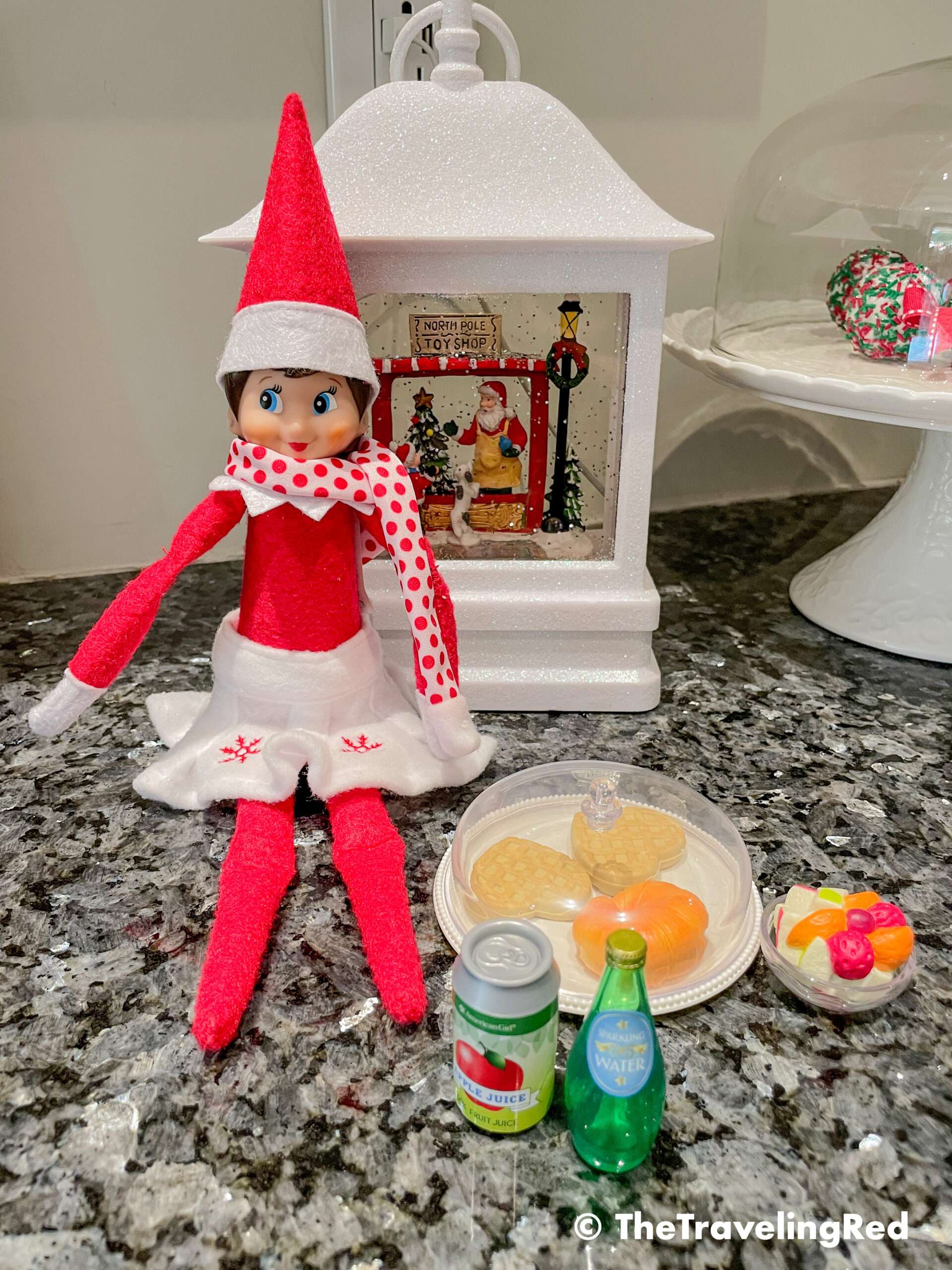 Naughty Elf on the shelf made herself a fancy breakfast using the pretend food from the American Girl Dolls set. She even put on a scarf for the occasion. Fun and easy elf on the shelf ideas for a naughty elf that are quick and easy using things you have at home.