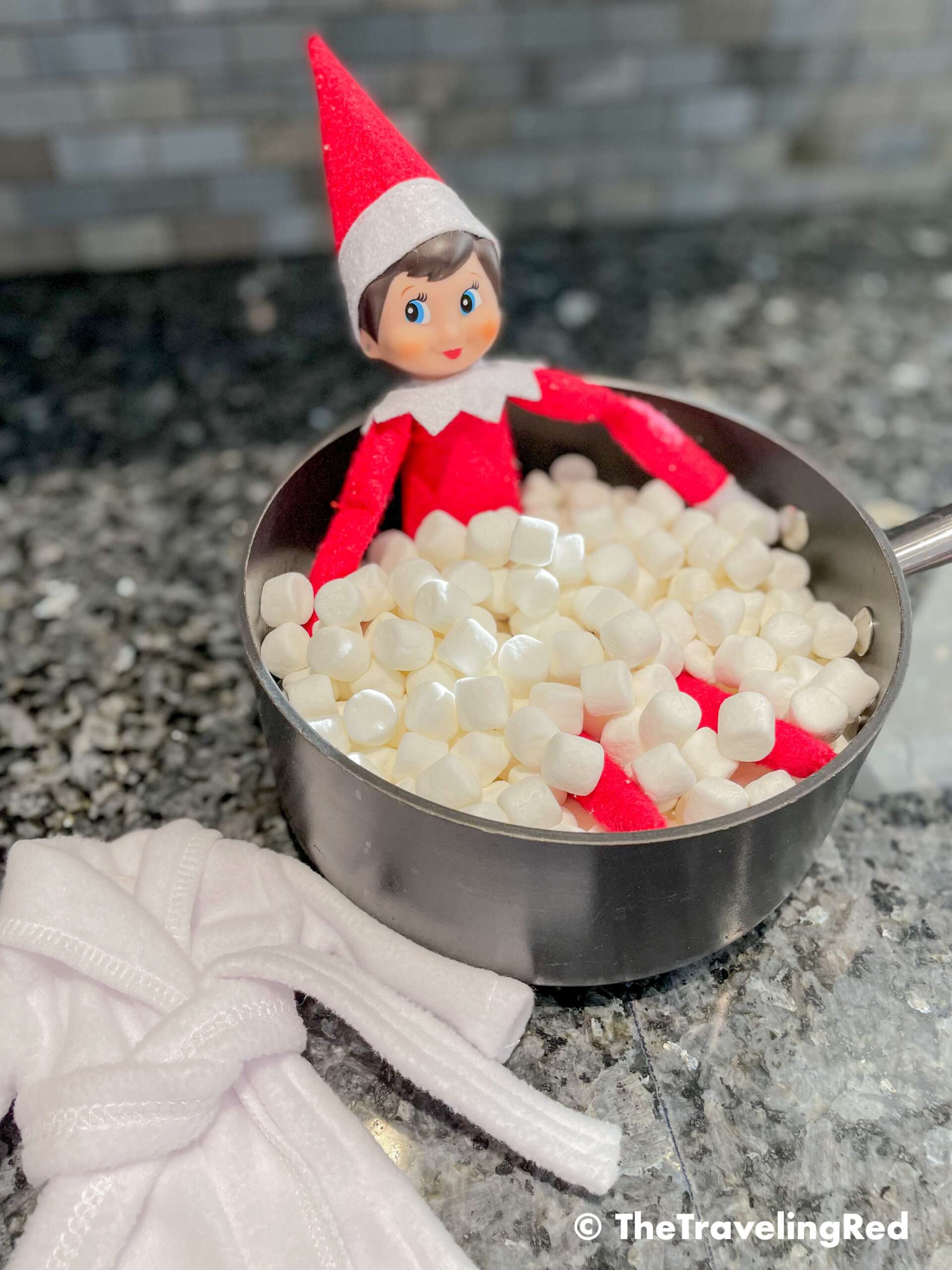 Naughty Elf on the shelf turned a pot into a hot tub. Fun and easy elf on the shelf ideas for a naughty elf that are quick and easy using things you have at home.