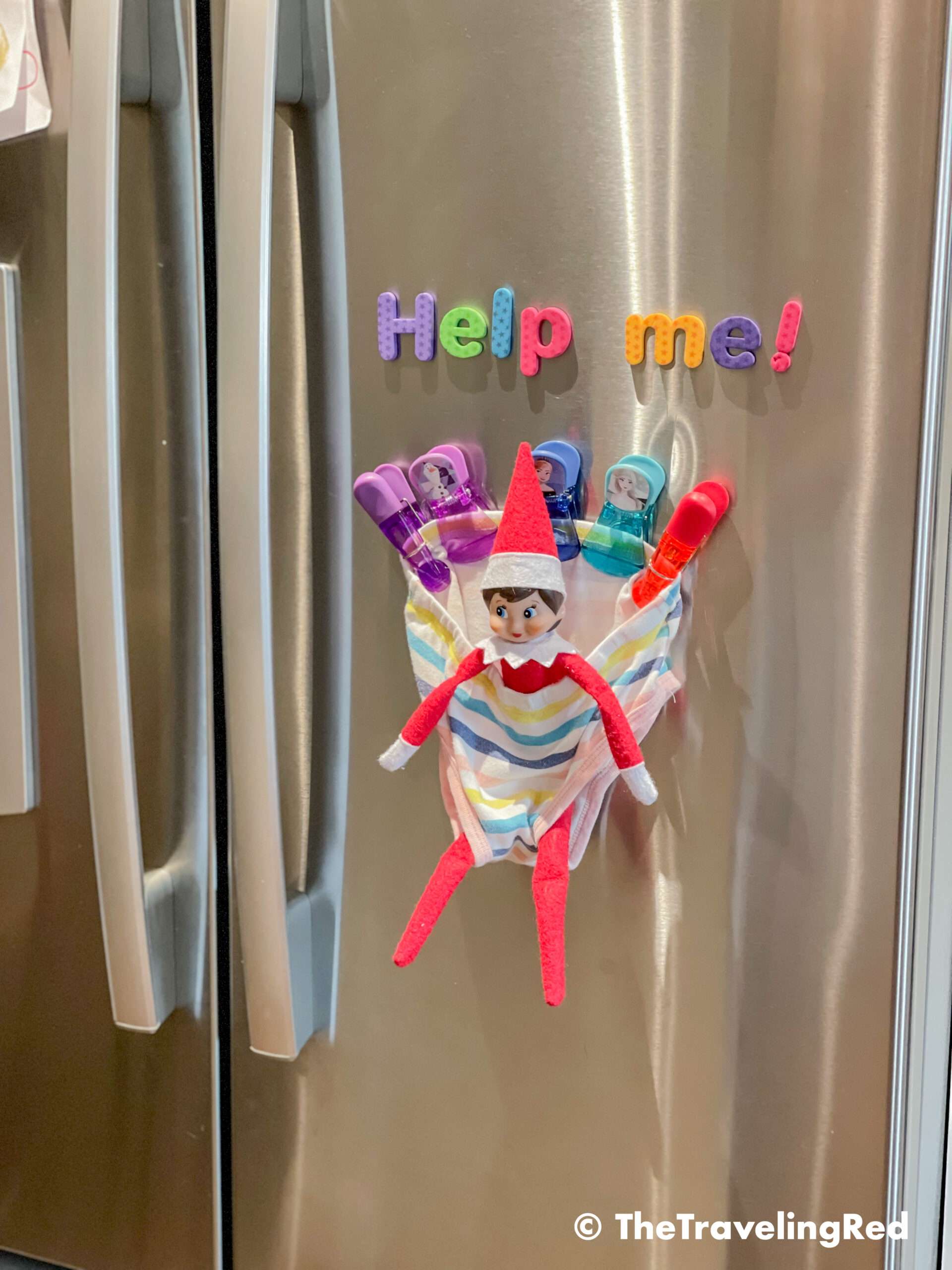 Naughty Elf on the shelf got stuck in an undie on our fridge. All you need is a panty, some magnet clips or tape and possibly a fun message. Fun and easy elf on the shelf ideas for a naughty elf that are quick and easy using things you have at home.