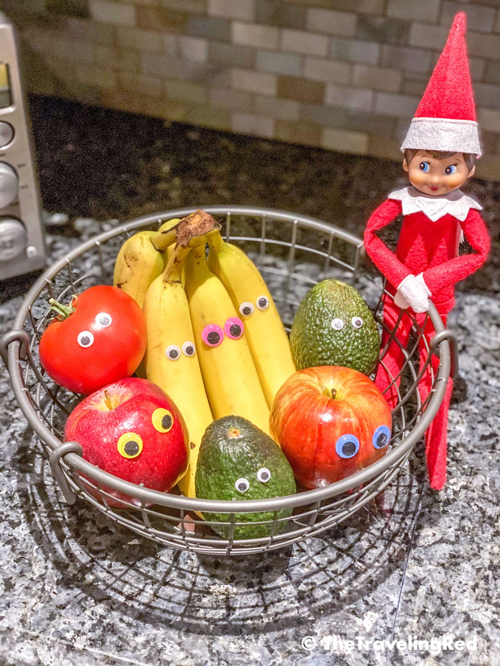 Naughty Elf on the shelf put googly eyes on all of our fruit in the fruit basket. Fun and easy elf on the shelf ideas for a naughty elf that are quick and easy using things you have at home.