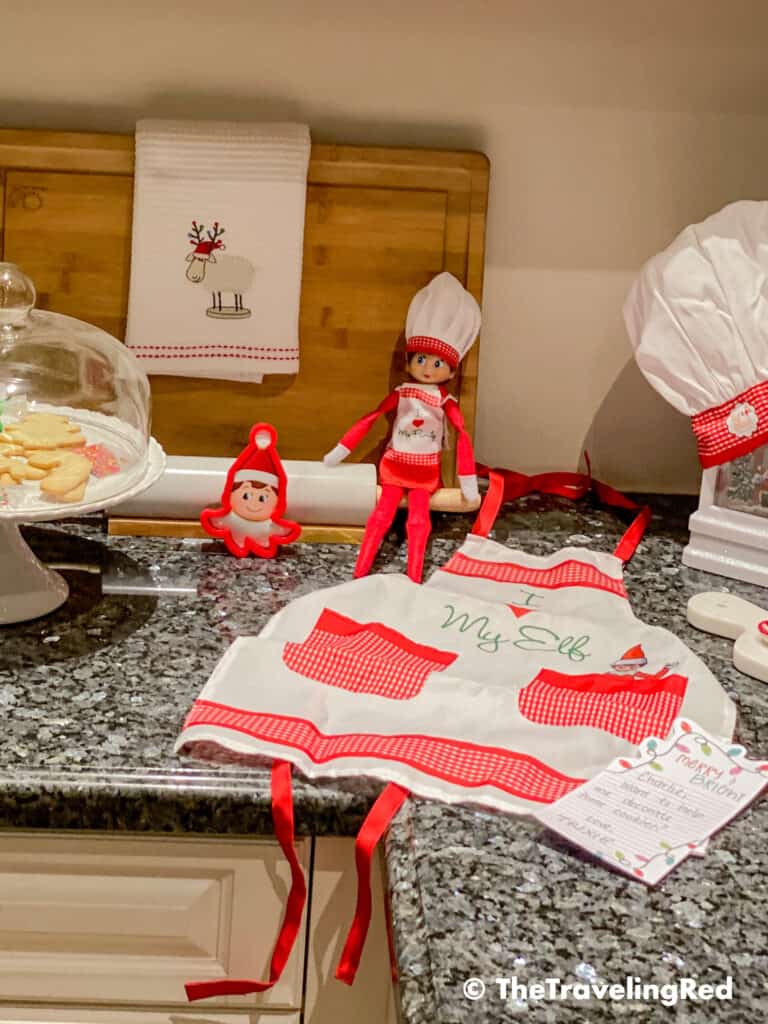 Naughty Elf on the shelf brought an apron so they could decorate cookies together. Fun and easy elf on the shelf ideas for a naughty elf that are quick and easy using things you have at home.