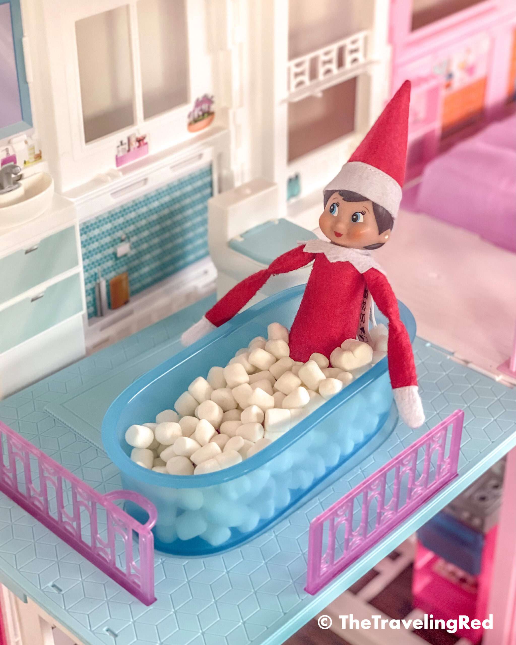 Naughty Elf on the shelf had a bubble bath in the barbie house tub using mini marshmallows. Fun and easy elf on the shelf ideas for a naughty elf that are quick and easy using things you have at home.