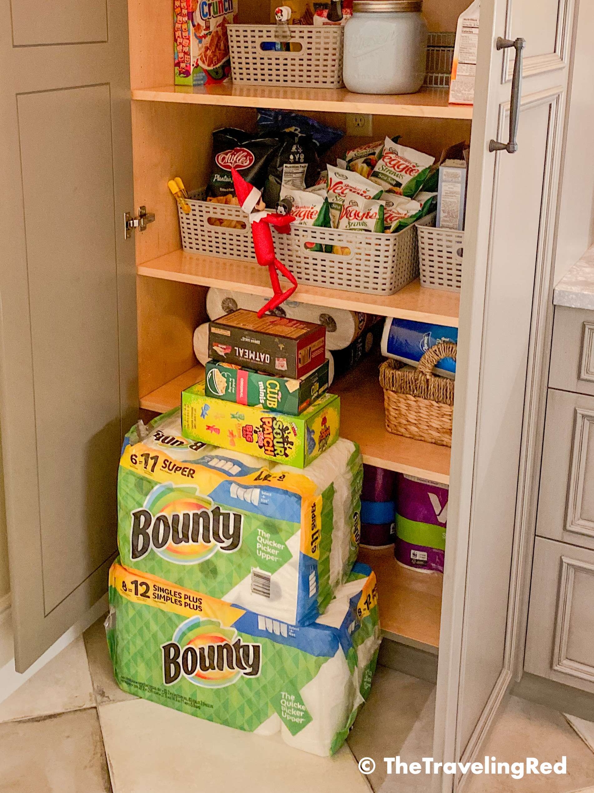 Naughty Elf on the shelf used household items to climb into the pantry to steal snacks. Fun and easy elf on the shelf ideas for a naughty elf that are quick and easy using things you have at home.